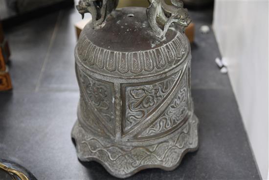 A Chinese bronze temple bell, Qing dynasty, 36cm